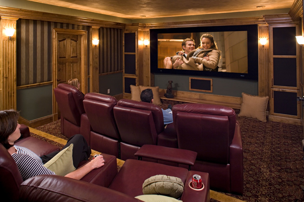 Inspiration for a large traditional enclosed home theatre in Minneapolis with carpet and a projector screen.