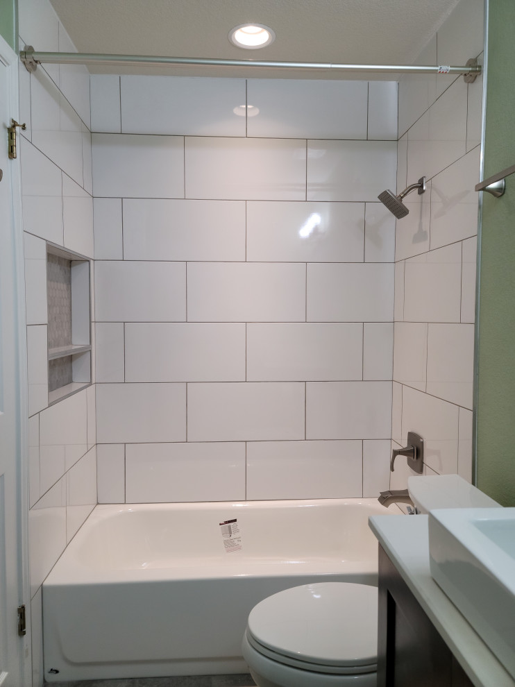 Mid-sized 1960s white tile and porcelain tile ceramic tile, gray floor and single-sink bathroom photo in Austin with shaker cabinets, dark wood cabinets, a two-piece toilet, green walls, a vessel sink, quartz countertops, white countertops, a niche and a freestanding vanity