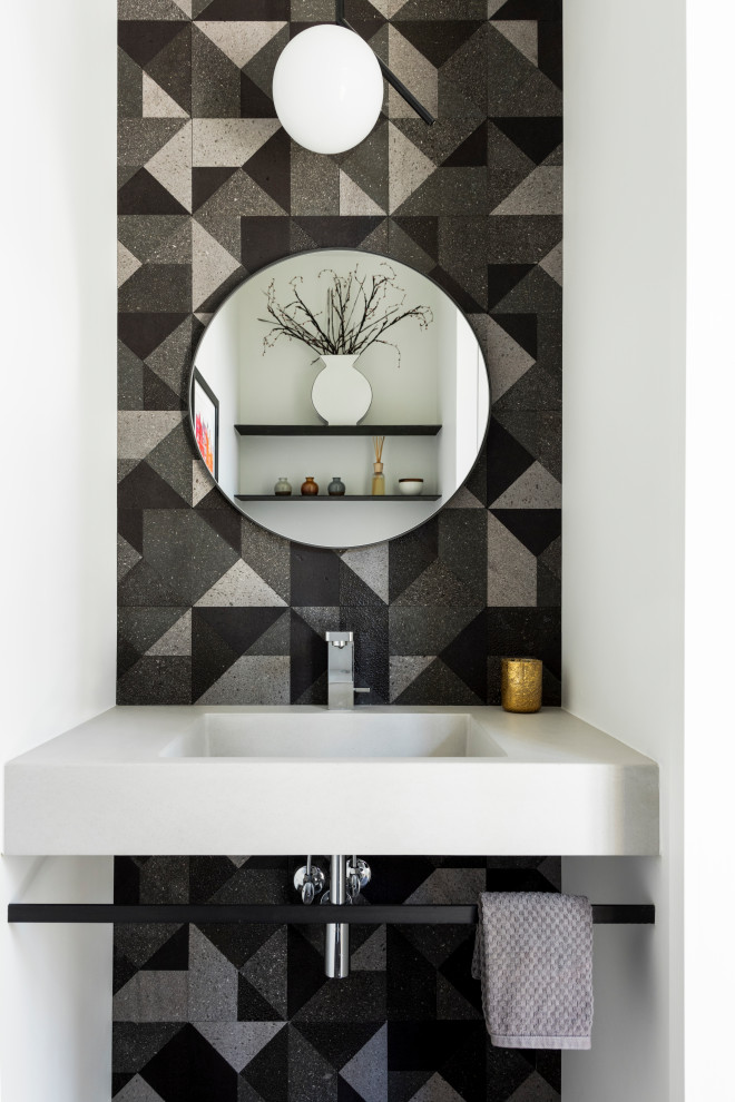 Design ideas for a contemporary powder room in Denver with black and white tile, white walls, an integrated sink and white benchtops.