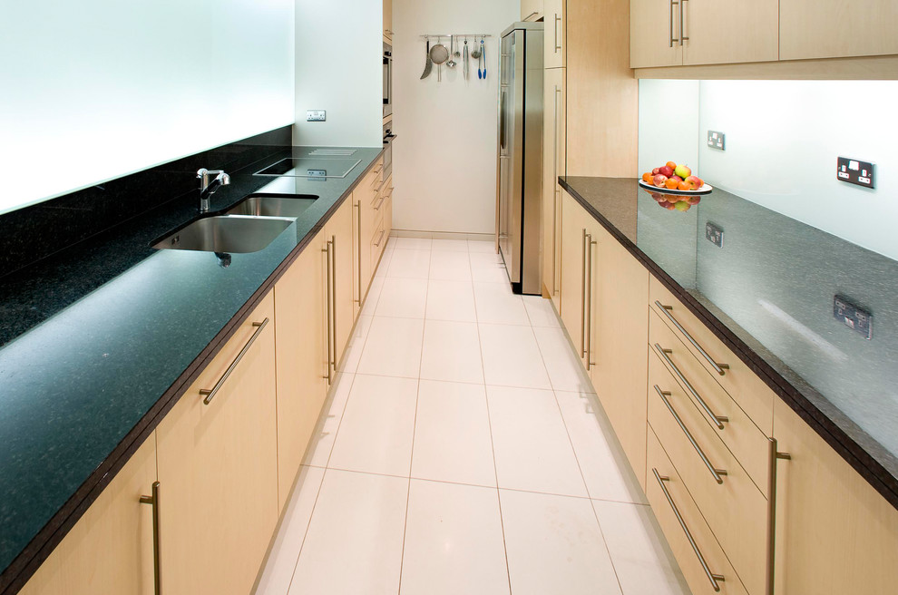 Inspiration for a mid-sized contemporary galley separate kitchen in London with no island.