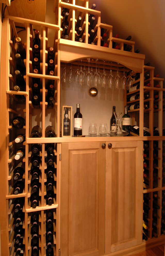 Inspiration for a mid-sized traditional wine cellar in Seattle with storage racks.