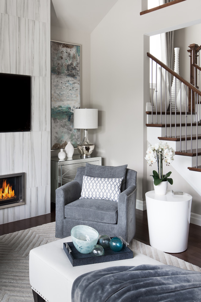 Inspiration for a mid-sized contemporary enclosed dark wood floor living room remodel in Toronto with white walls, a standard fireplace, a tile fireplace and a wall-mounted tv