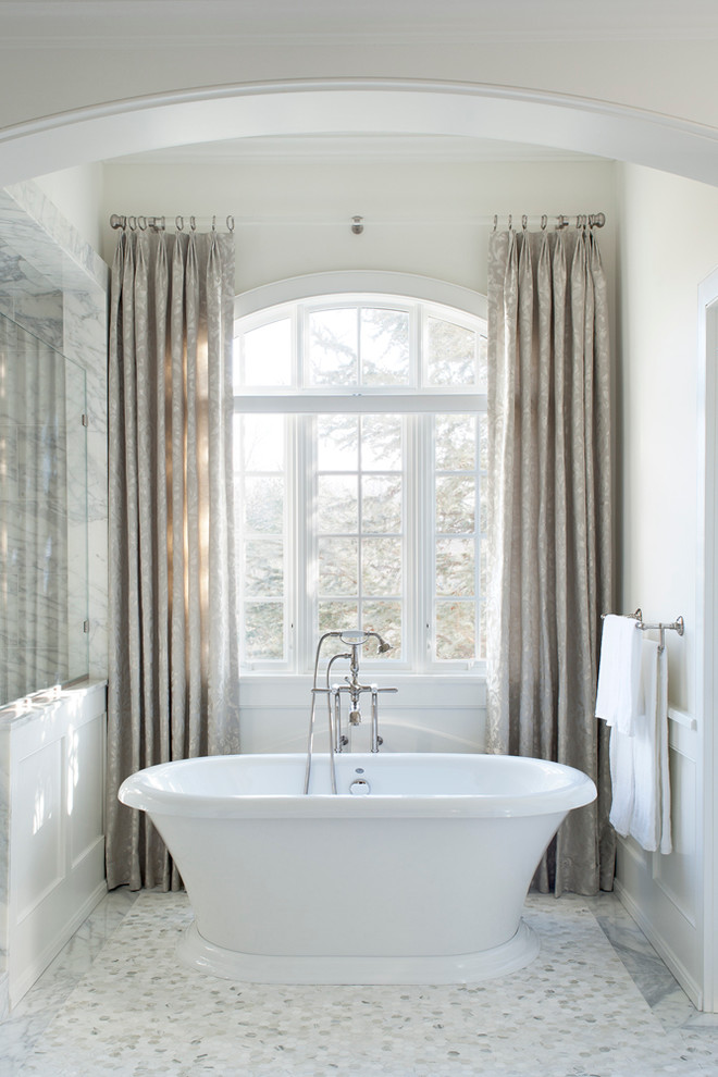 Inspiration for a traditional master bathroom in Philadelphia with a freestanding tub and white walls.