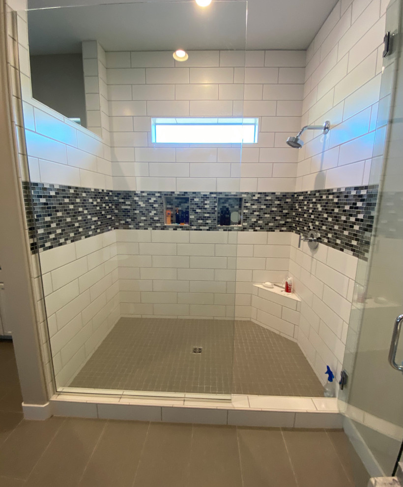 Photo of a large modern master wet room bathroom in Phoenix with ceramic tile, white walls, travertine floors, brown floor and a hinged shower door.