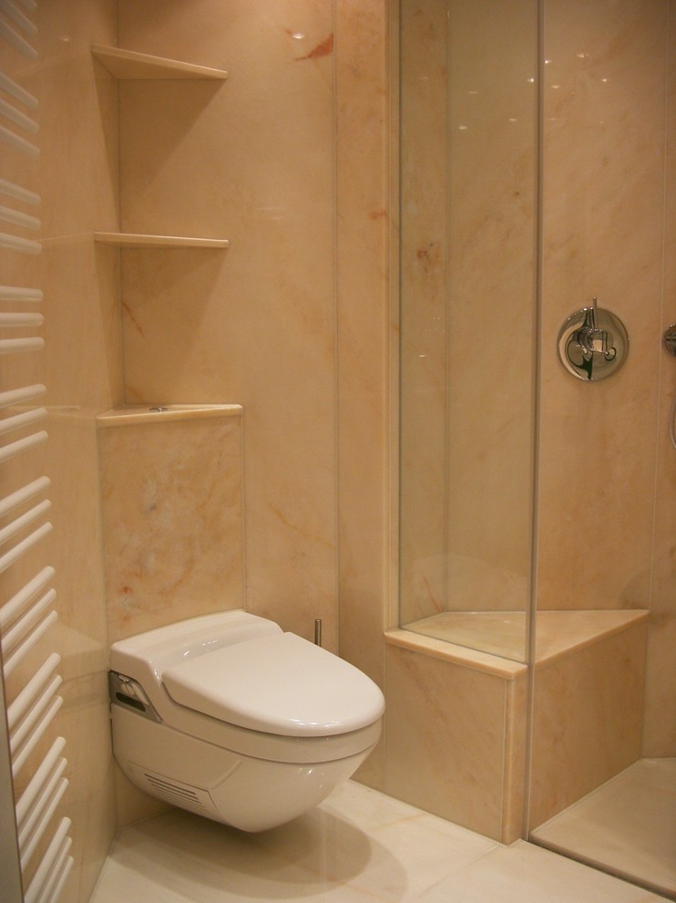Small contemporary 3/4 bathroom in Stuttgart with a curbless shower, a wall-mount toilet, pink tile, ceramic tile, pink walls, marble floors, an integrated sink, marble benchtops, pink floor, a hinged shower door and pink benchtops.