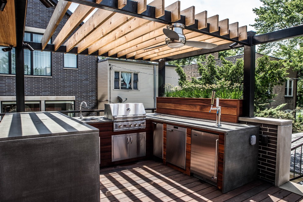 Mid-sized contemporary backyard deck in Orange County with an outdoor kitchen and a pergola.