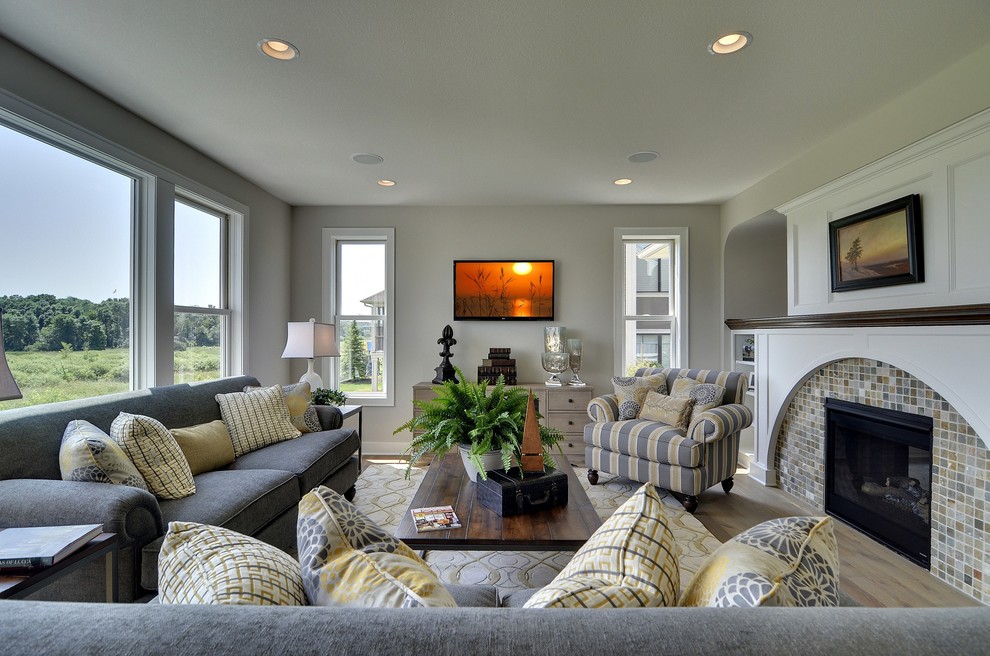 Photo of a traditional family room in Minneapolis with white walls.