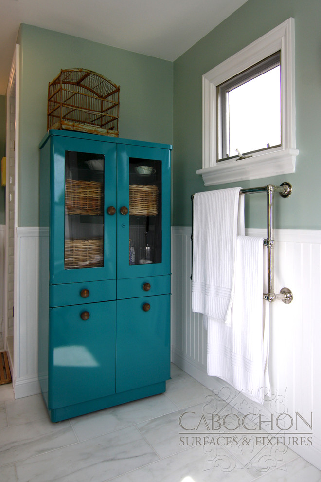 Design ideas for a mid-sized beach style master bathroom in San Diego with a pedestal sink, a claw-foot tub, an alcove shower, a one-piece toilet, furniture-like cabinets, turquoise cabinets, white tile, stone tile, green walls and marble floors.