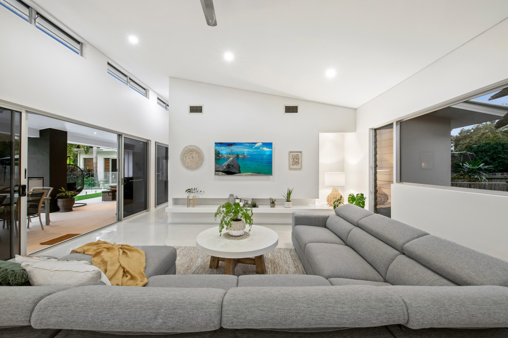 Design ideas for a contemporary living room in Sunshine Coast with white walls and white floor.