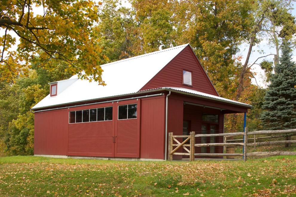 Modern red exterior in New York with wood siding and a gable roof.
