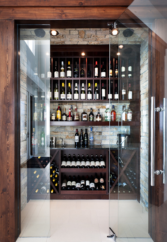 This is an example of a contemporary wine cellar in Vancouver with display racks and white floor.