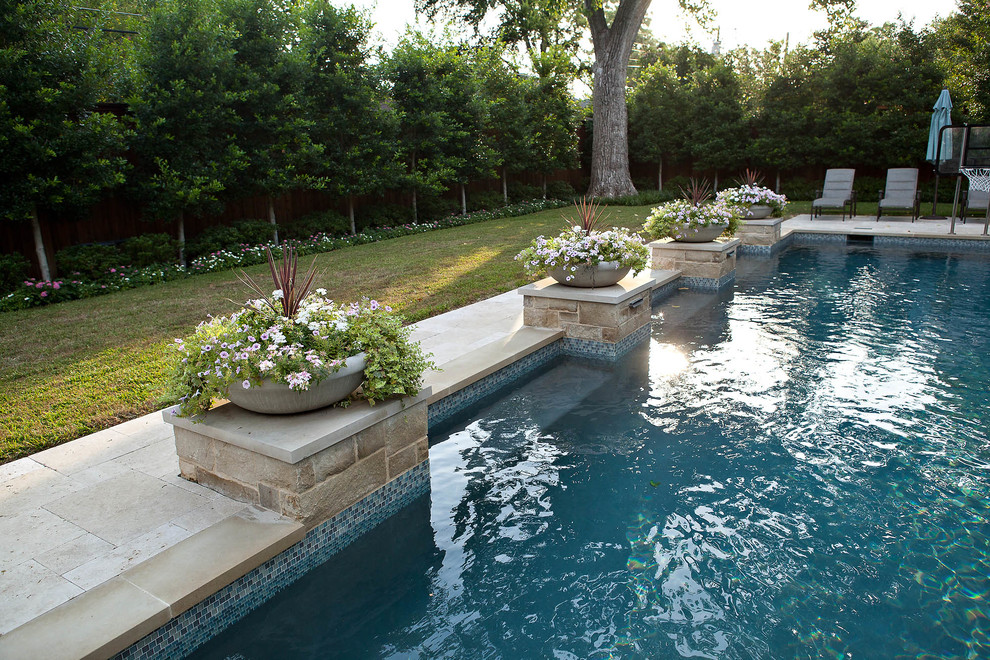 Large traditional backyard rectangular pool in Dallas.