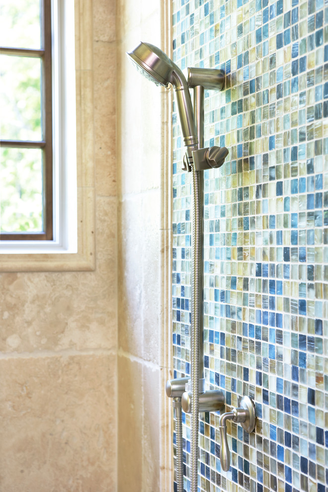 Example of a mountain style master multicolored tile doorless shower design