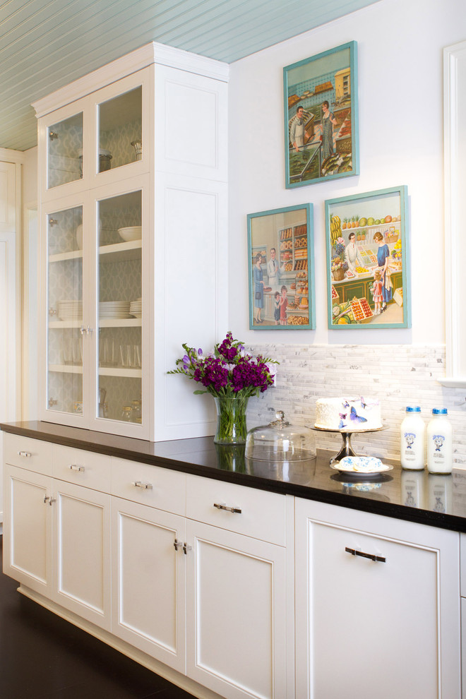 Photo of a traditional kitchen in Los Angeles with glass-front cabinets.