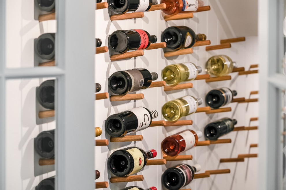Inspiration for a wine cellar in Sydney with display racks.