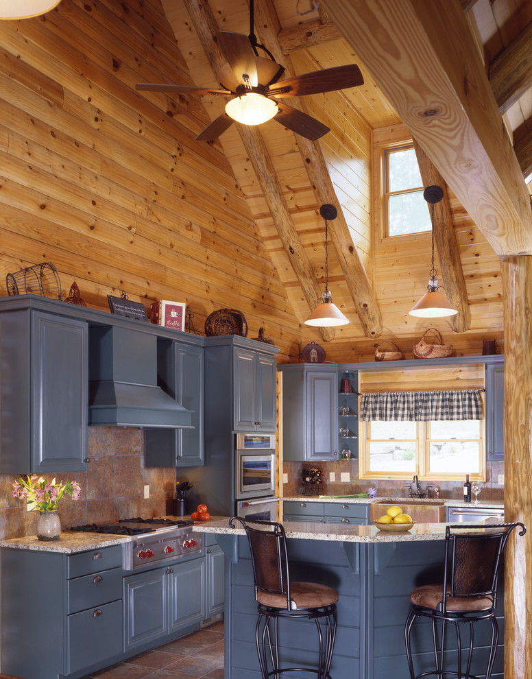 Example of a l-shaped kitchen design with a farmhouse sink and blue cabinets