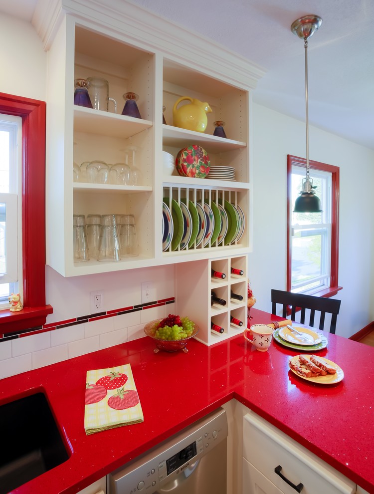 Inspiration for a small eclectic l-shaped eat-in kitchen in Portland with an undermount sink, shaker cabinets, white cabinets, solid surface benchtops, white splashback, subway tile splashback, stainless steel appliances, vinyl floors, a peninsula, white floor and red benchtop.