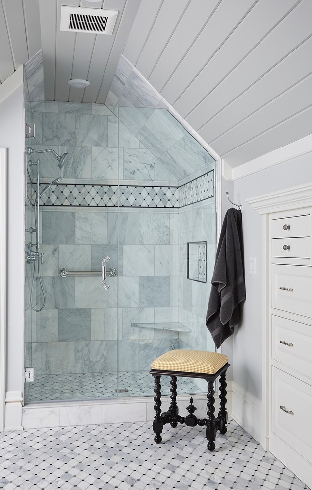 Photo of a mid-sized traditional master bathroom in Minneapolis with beaded inset cabinets, white cabinets, an alcove shower, gray tile, marble, grey walls, mosaic tile floors, engineered quartz benchtops, grey floor and a hinged shower door.