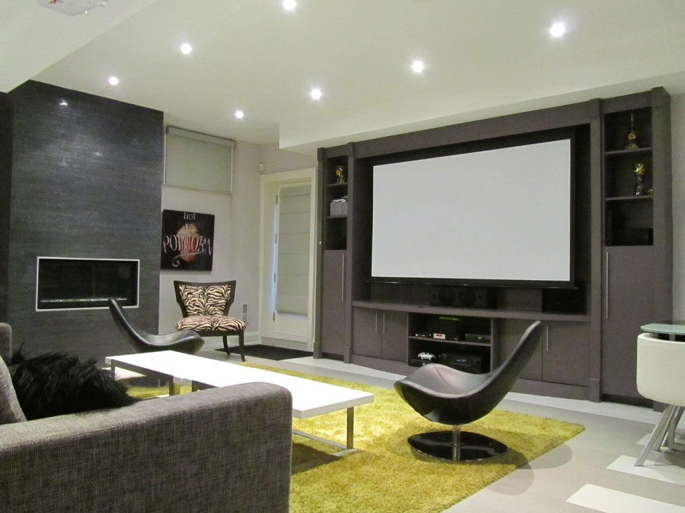 Photo of a contemporary open concept home theatre in Toronto with grey walls, ceramic floors, a projector screen and grey floor.