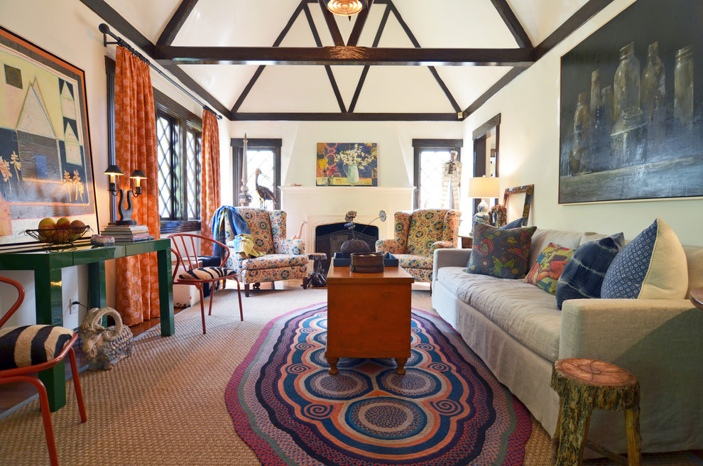 Eclectic formal and enclosed medium tone wood floor living room photo in Dallas with white walls, a standard fireplace and no tv