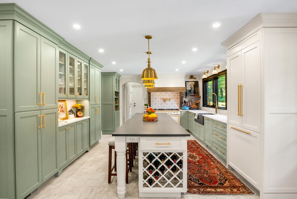 Large french country u-shaped porcelain tile and beige floor enclosed kitchen photo in New York with a farmhouse sink, recessed-panel cabinets, green cabinets, quartz countertops, beige backsplash, ceramic backsplash, paneled appliances, an island and white countertops