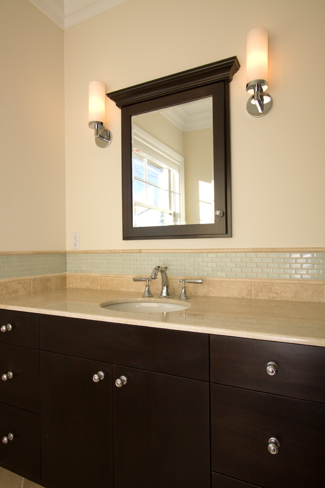 Example of a large transitional master beige tile and mosaic tile porcelain tile drop-in bathtub design with flat-panel cabinets, black cabinets, beige walls, an undermount sink and granite countertops