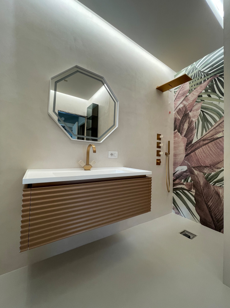 Photo of a small contemporary 3/4 bathroom in Rome with a curbless shower, pink walls, concrete floors, a drop-in sink, pink floor, white benchtops, a single vanity, a floating vanity, recessed and wallpaper.