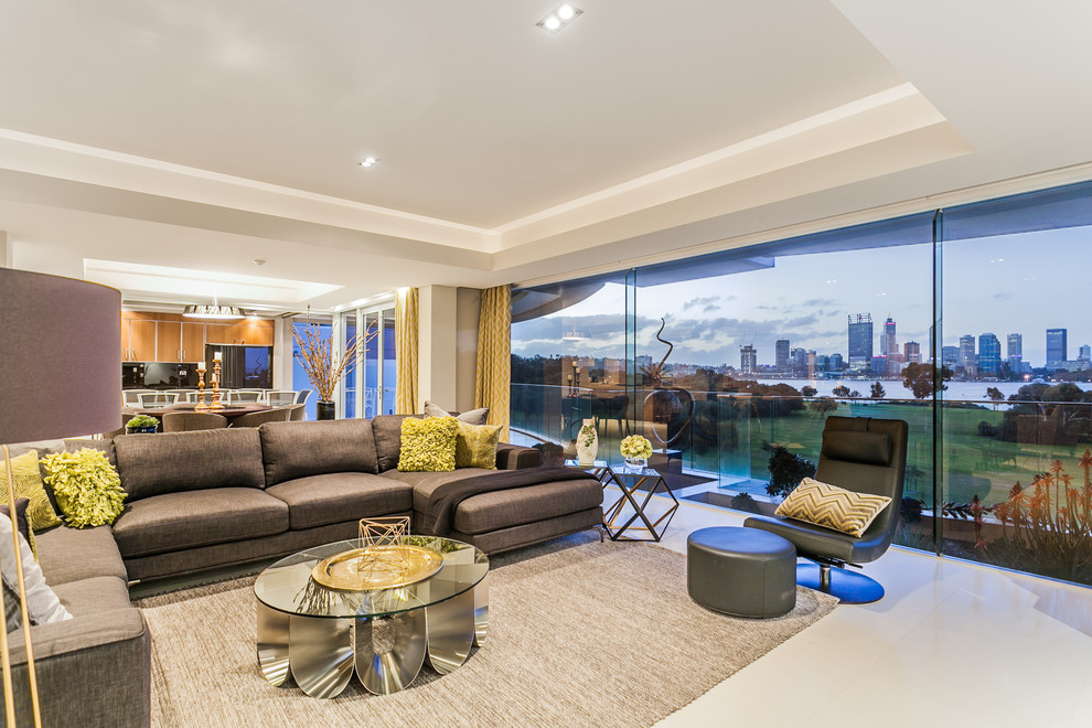 This is an example of a contemporary open concept living room in Perth with grey walls.