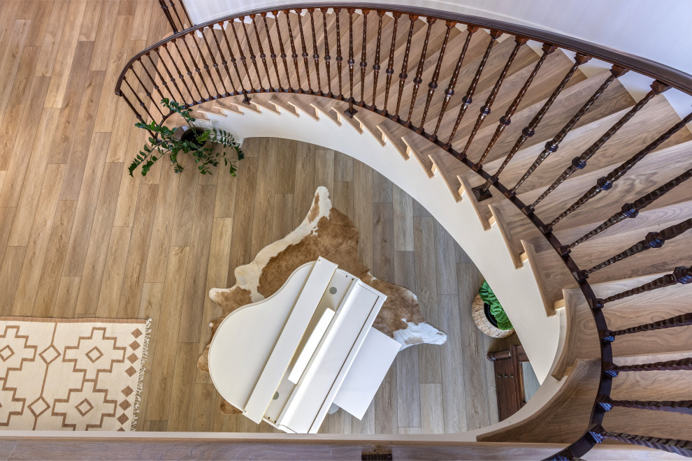 Curved Staircase Railing – Overhead Detail | Tuscan Farmhouse