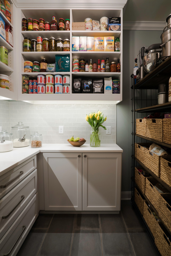 This is an example of a mid-sized country galley utility room in St Louis with an undermount sink, flat-panel cabinets, white cabinets, quartz benchtops, beige walls, porcelain floors, a side-by-side washer and dryer and grey floor.
