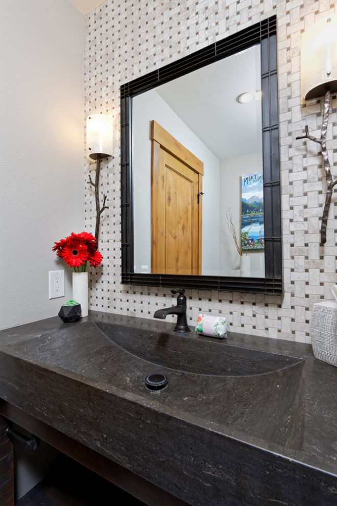 Photo of a mid-sized country powder room in Santa Barbara with a one-piece toilet, an undermount sink and a built-in vanity.
