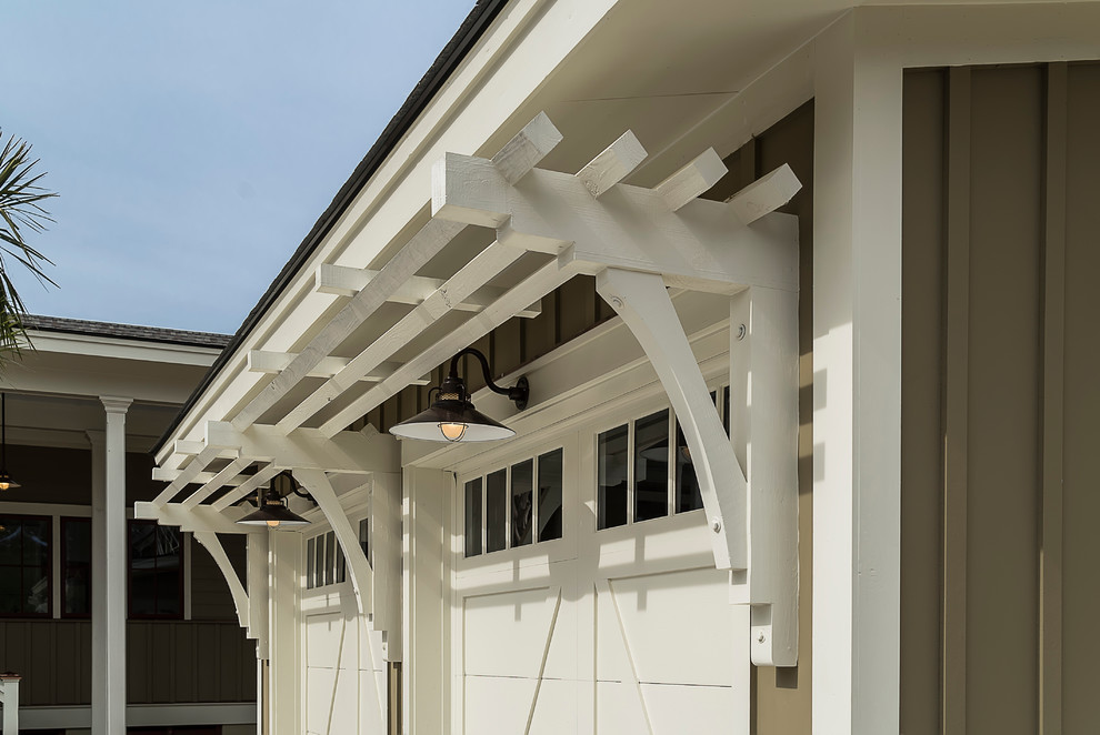 This is an example of a mid-sized arts and crafts attached two-car carport in Atlanta.