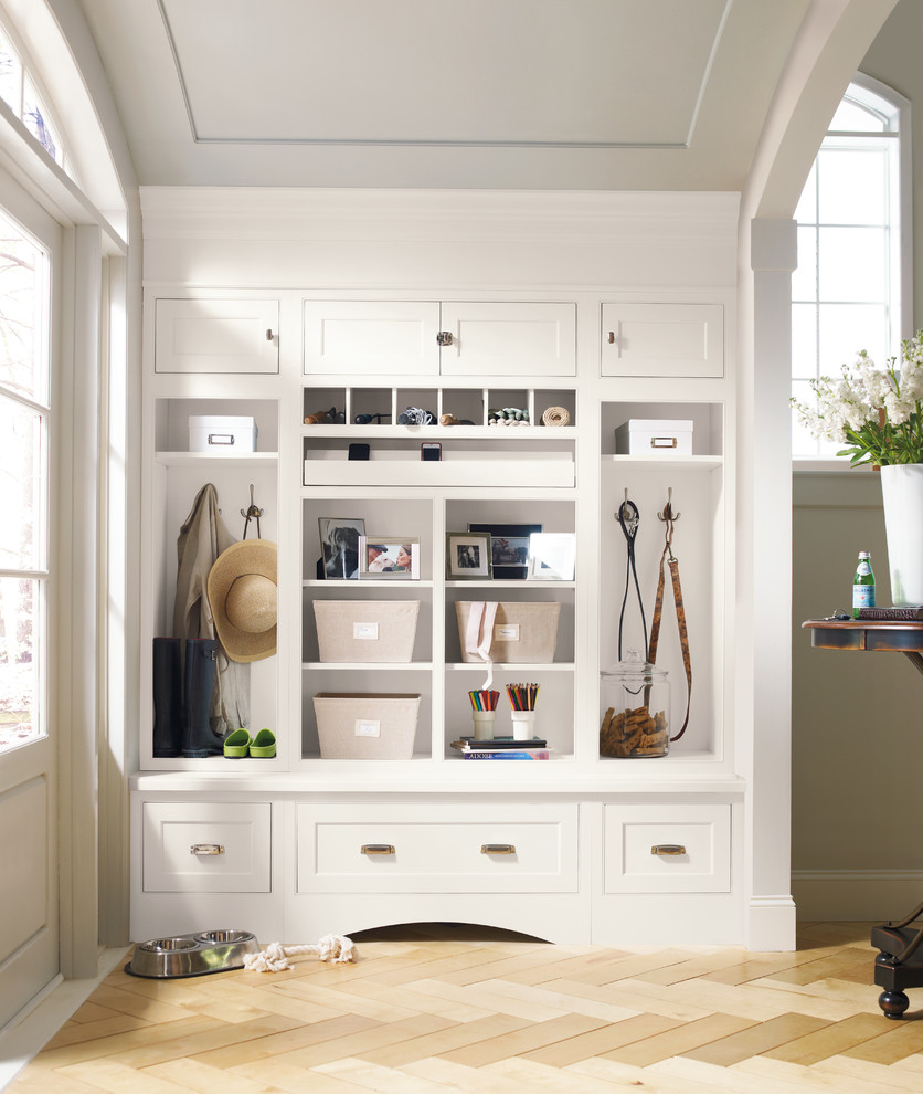 Design ideas for a mid-sized transitional mudroom in Newark with beige walls, light hardwood floors and beige floor.