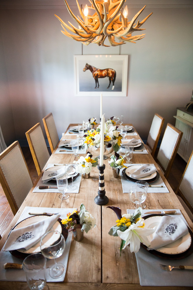 Mid-sized mountain style enclosed dining room photo in Dallas with gray walls