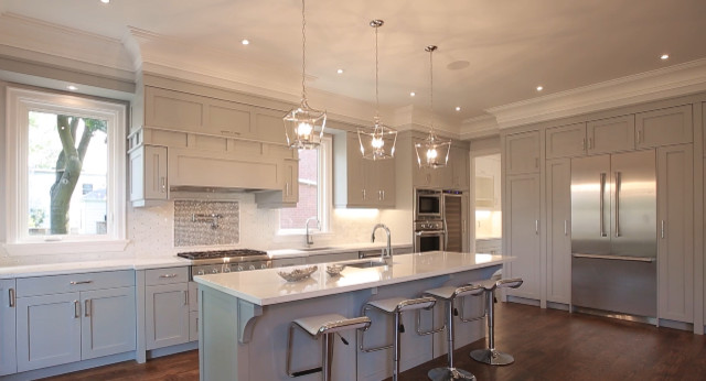 Kitchen pantry - large transitional galley medium tone wood floor kitchen pantry idea in Toronto with an undermount sink, shaker cabinets, gray cabinets, quartz countertops, white backsplash, mosaic tile backsplash, stainless steel appliances and an island
