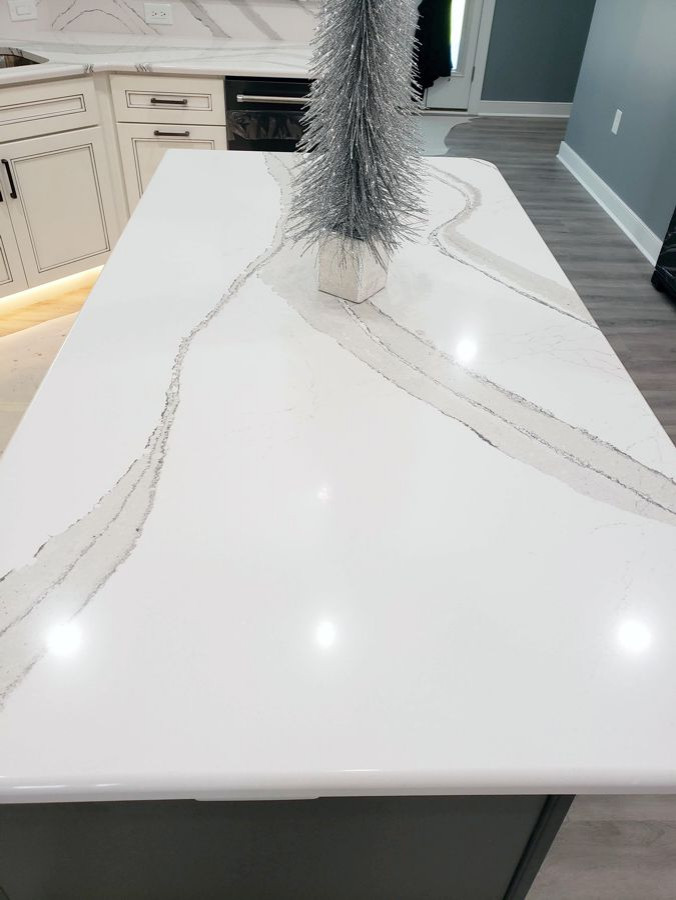 Transitional u-shaped eat-in kitchen photo with recessed-panel cabinets, white cabinets, quartz countertops, multicolored backsplash, mosaic tile backsplash, two islands and white countertops