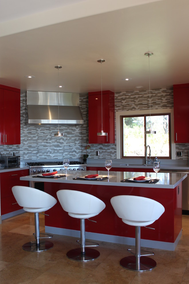 Inspiration for a large contemporary u-shaped eat-in kitchen in San Diego with a double-bowl sink, flat-panel cabinets, red cabinets, quartzite benchtops, grey splashback, mosaic tile splashback, stainless steel appliances, travertine floors and with island.