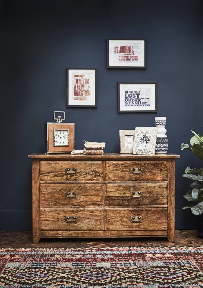Design ideas for a large bohemian master bedroom with blue walls, medium hardwood flooring and brown floors.