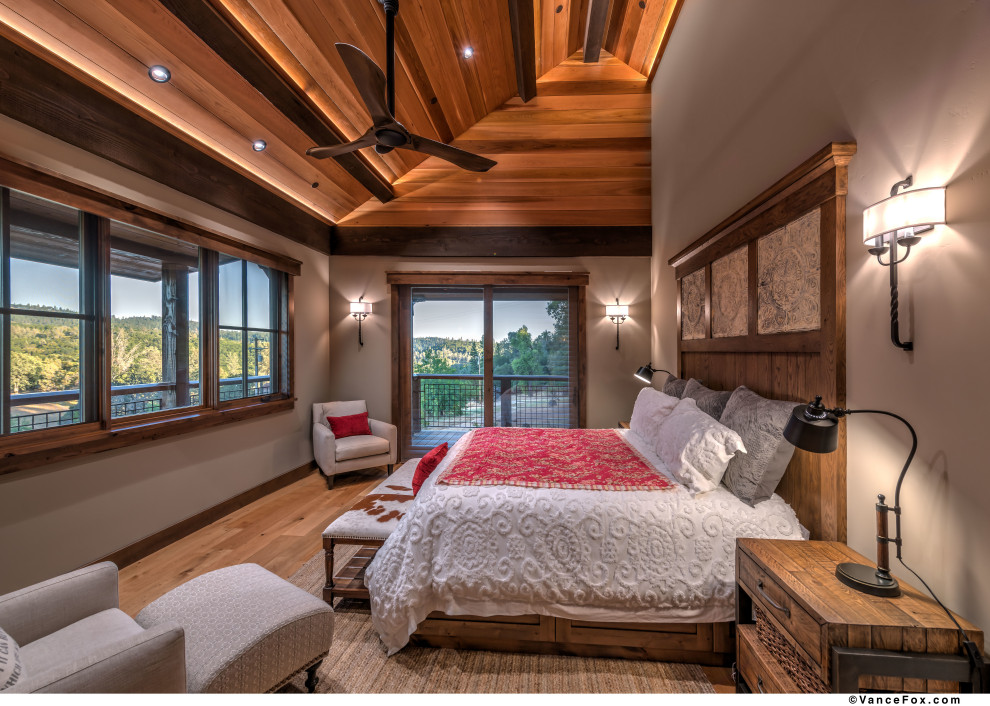 This is an example of a contemporary master bedroom in Other with beige walls, light hardwood floors, beige floor and wood.