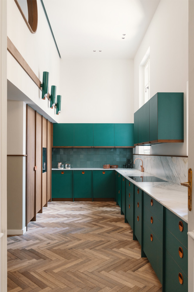 This is an example of a large contemporary u-shaped separate kitchen in Turin with a single-bowl sink, flat-panel cabinets, green cabinets, green splashback, panelled appliances, no island, brown floor and white benchtop.
