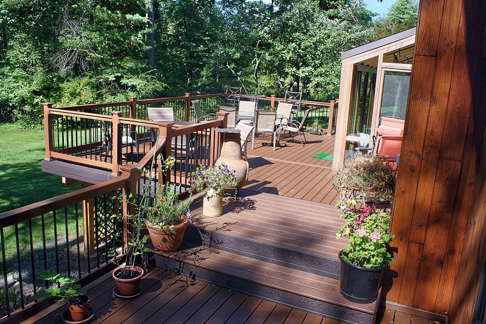 Mid-sized transitional backyard deck in Philadelphia with a fire feature and no cover.
