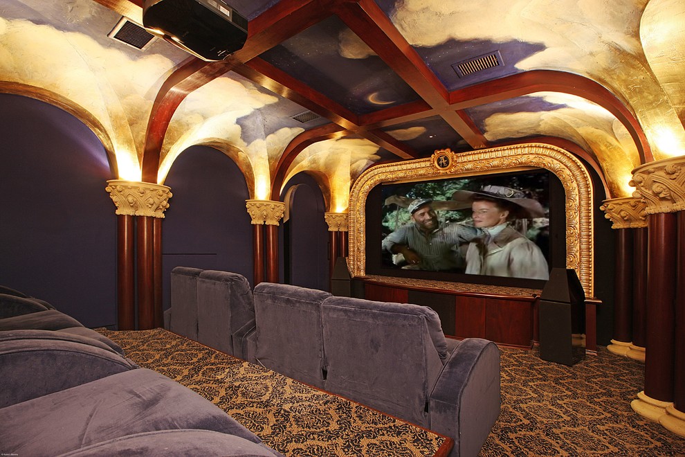 Design ideas for a mediterranean enclosed home theatre in Miami with carpet and a projector screen.