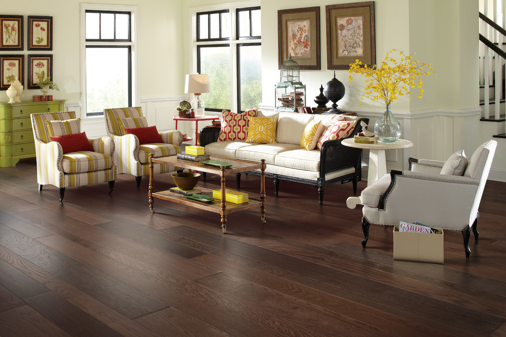 Inspiration for a mid-sized traditional formal open concept living room in Atlanta with dark hardwood floors, yellow walls, brown floor, no fireplace and no tv.