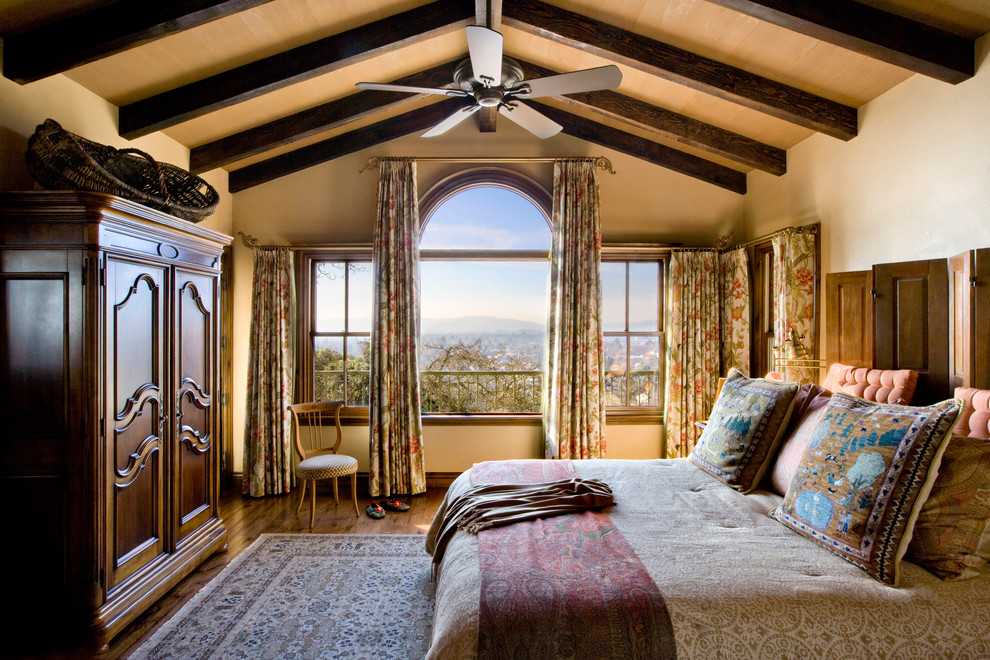 Design ideas for a country bedroom in San Francisco with beige walls and dark hardwood floors.
