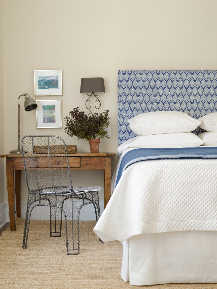 Transitional bedroom in New York with beige walls.