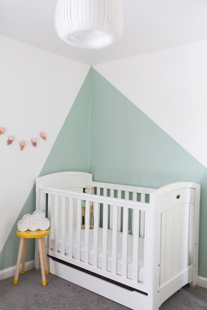 Inspiration for a small scandinavian kids' room for girls in Surrey with green walls, carpet and grey floor.