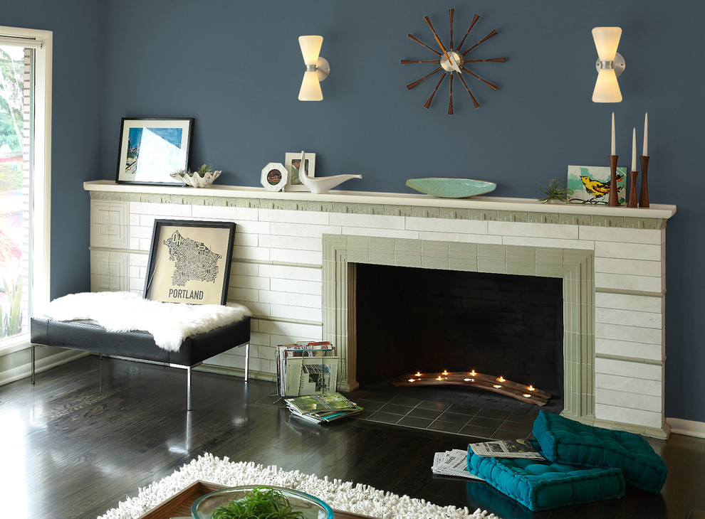 This is an example of a midcentury living room in Portland with blue walls.