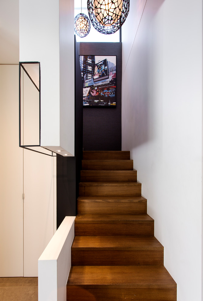 Inspiration for a small contemporary wood l-shaped staircase in Melbourne with wood risers.