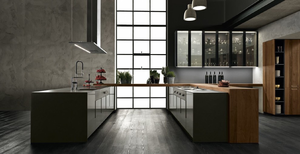 Design ideas for a large contemporary u-shaped eat-in kitchen in San Francisco with an integrated sink, flat-panel cabinets, grey cabinets, wood benchtops, grey splashback, black appliances, dark hardwood floors, a peninsula, black floor and brown benchtop.