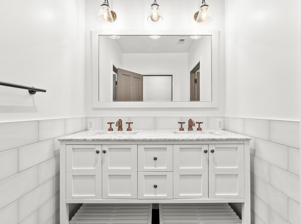 Large transitional master bathroom in Los Angeles with shaker cabinets, white cabinets, white tile, subway tile, white walls, porcelain floors and black floor.